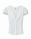 Generated with Kive.ai - Change only the fabric appearance of the blouse in Image 1 to match the fabric in Image 2 white fabric with evenly scattered small gray polka dots and a light_ slightly sheer woven appearance. App.webp